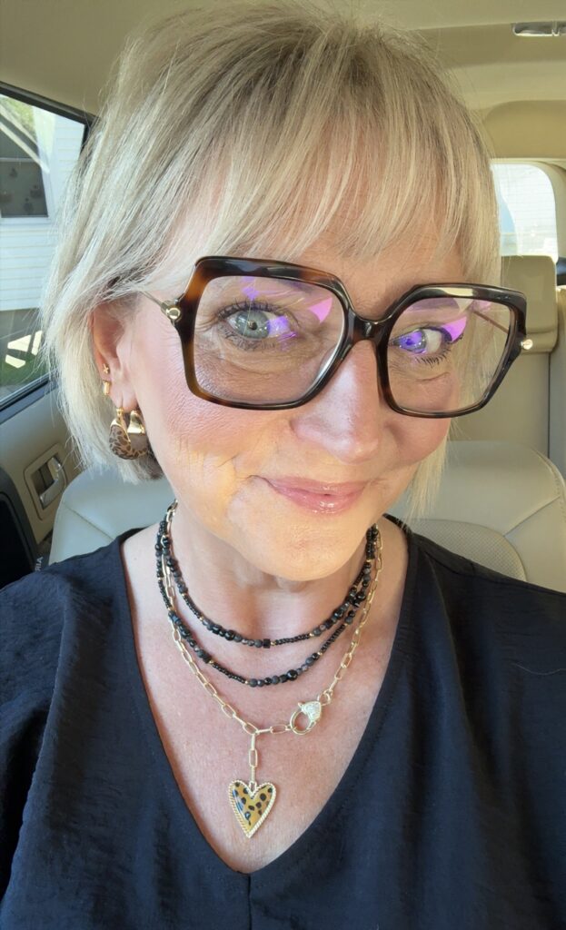 Jennifer Lippy smiling in layered necklaces